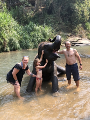 Getting wet with a baby elephant